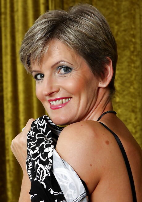 Very attractive aged Melanie exposing big hooters and spreading her legs 