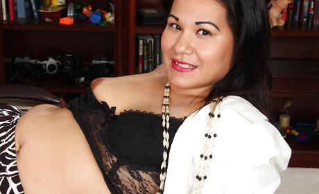 Very attractive oriental mature Susie Jhonson in lingerie exposes small tits and bald pussy 