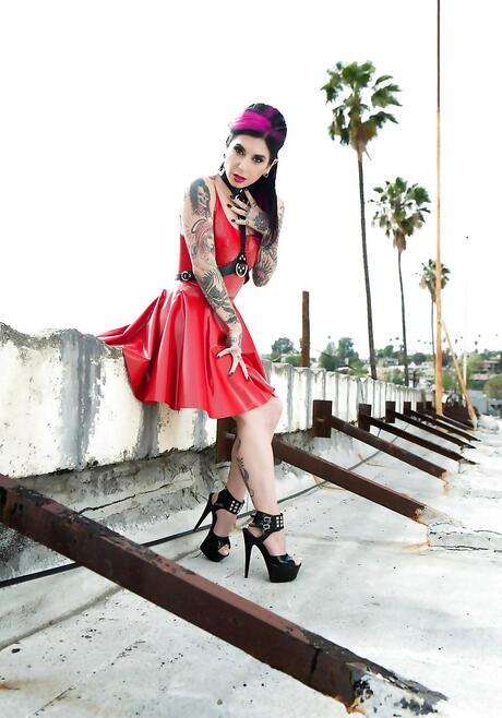 Hot american red-haired milf Joanna Angel in nice skirt shows her butt and spreads her legs outside