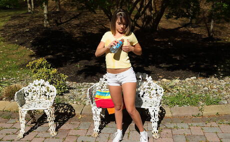 Svelte american teen Kimmy Granger in sexy shorts exposing tiny tits and dildoing outside